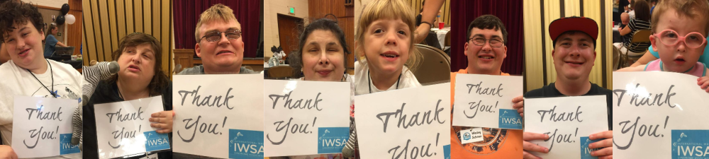 Children and Adults with WAGR Syndrome holding signs saying 