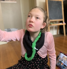 Young girl with green necklace 