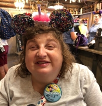 Girl smiling with Mickey Mouse Ears