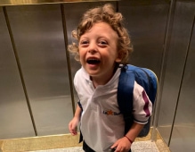 Boy smiling with backpack