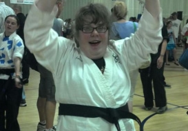 Girl smiling in karate uniform