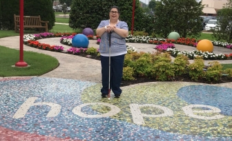 Caroline (adult with WAGR syndrome) standing on HOPE at St Jude Children's Research Hospital