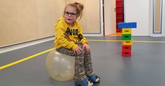 Image of girl sitting on ball