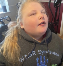 Young girl with WAGR syndrome sweatshirt