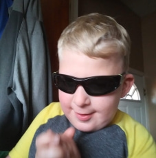Image of young boy in sunglasses