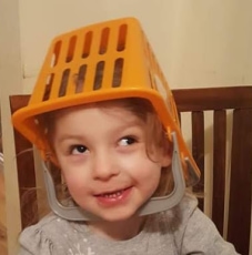 Image of young girl with basket on head