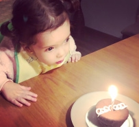 Young child with birthday cupcake