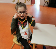 Young girl with toy stethoscope  