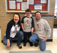 Image of family selling t-shirts